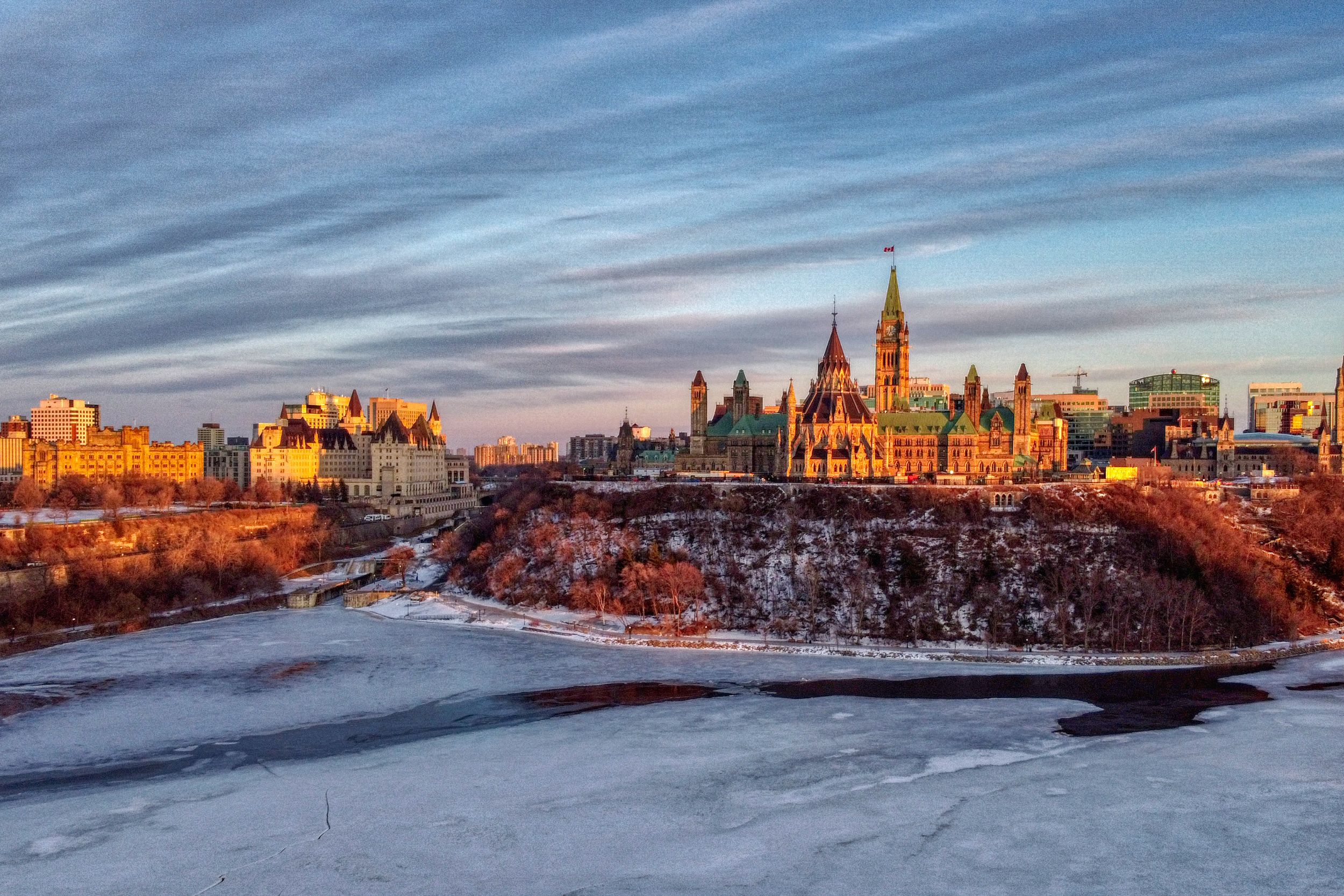 Cityscape with frozen river and buildings