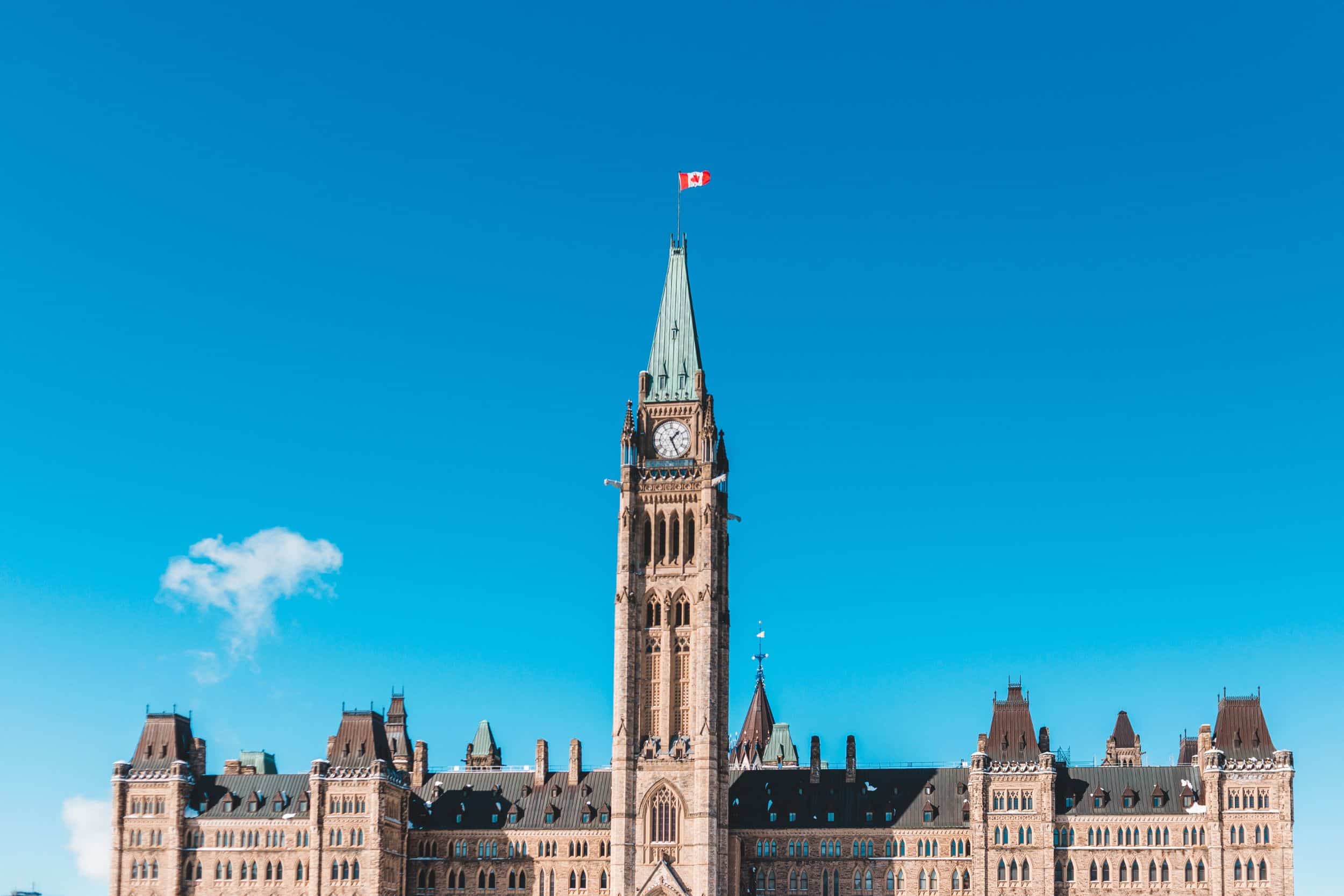 Parliament Hill with Canadian flag
