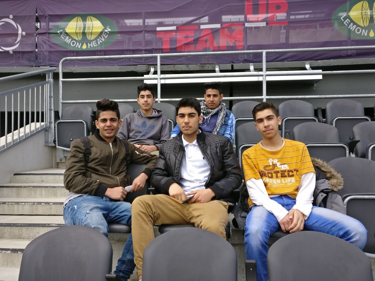 A group of youth newcomers attend an Ottawa Fury match