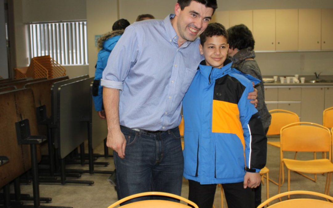 Jody Beeching, CCI Youth Program Coordinator with young Syrian boy