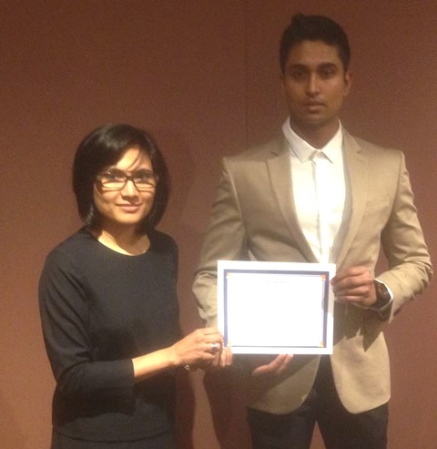 Rukhsana Ahmed, Associate Professor at the University of Ottawa presents certificate to Rayhan Pitigala. Rayhan was one of the winners of a writing contest launched by the Ottawa Multicultural Media Initiative (OMMI).