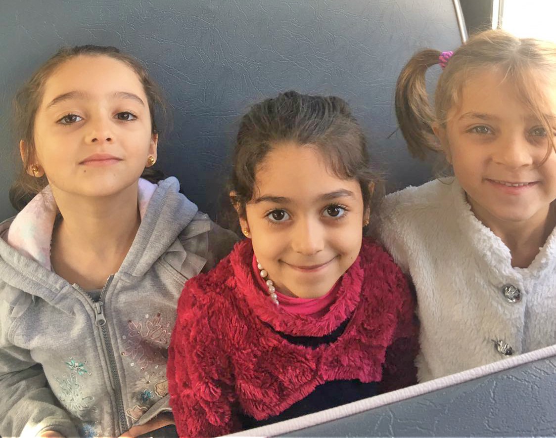 Three girls on a bus