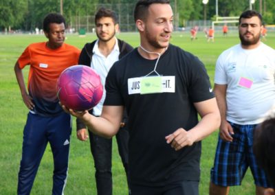 Young men handling a soccer ball